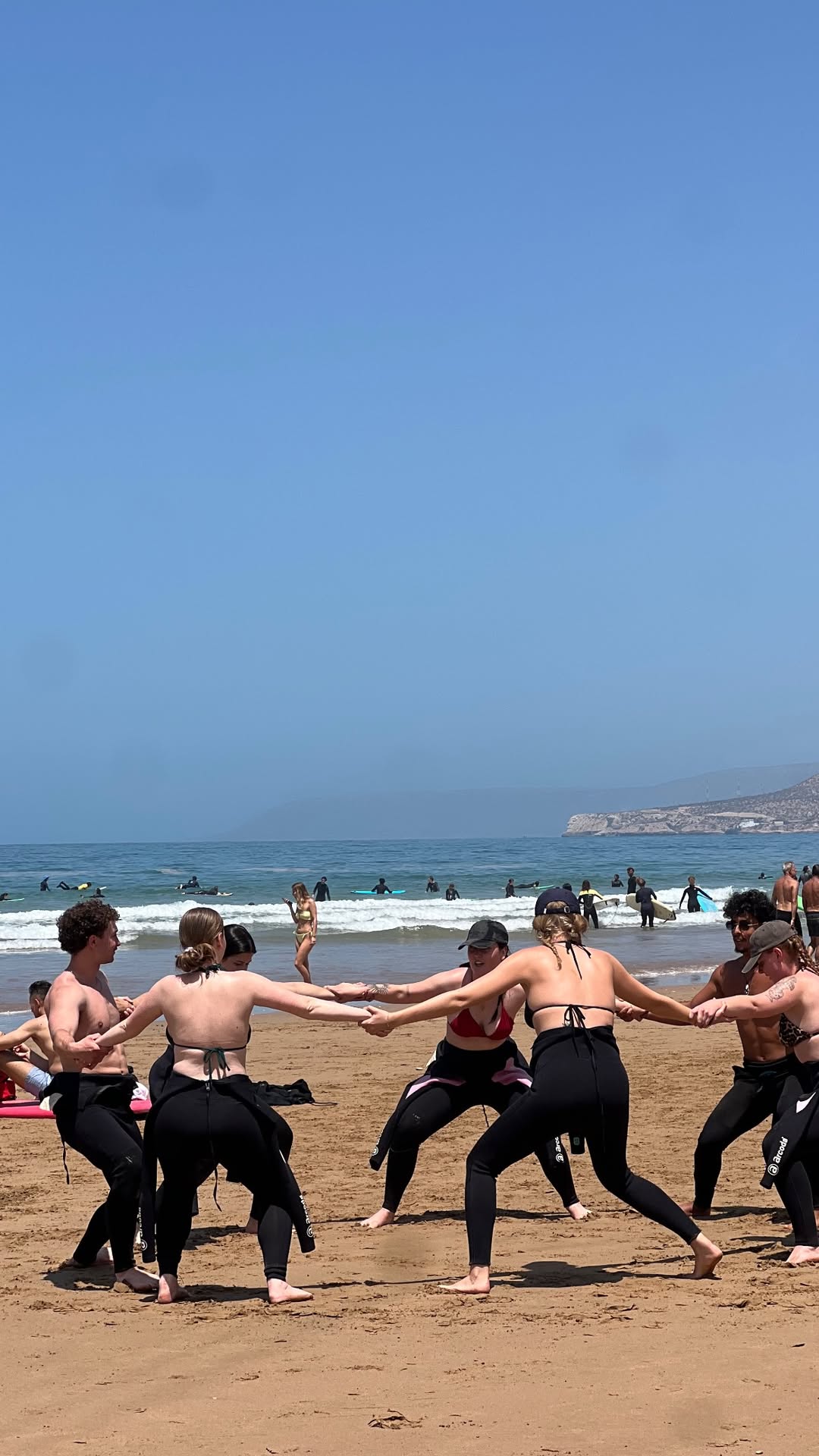 First surf lesson Taghazout warm up before beach instruction