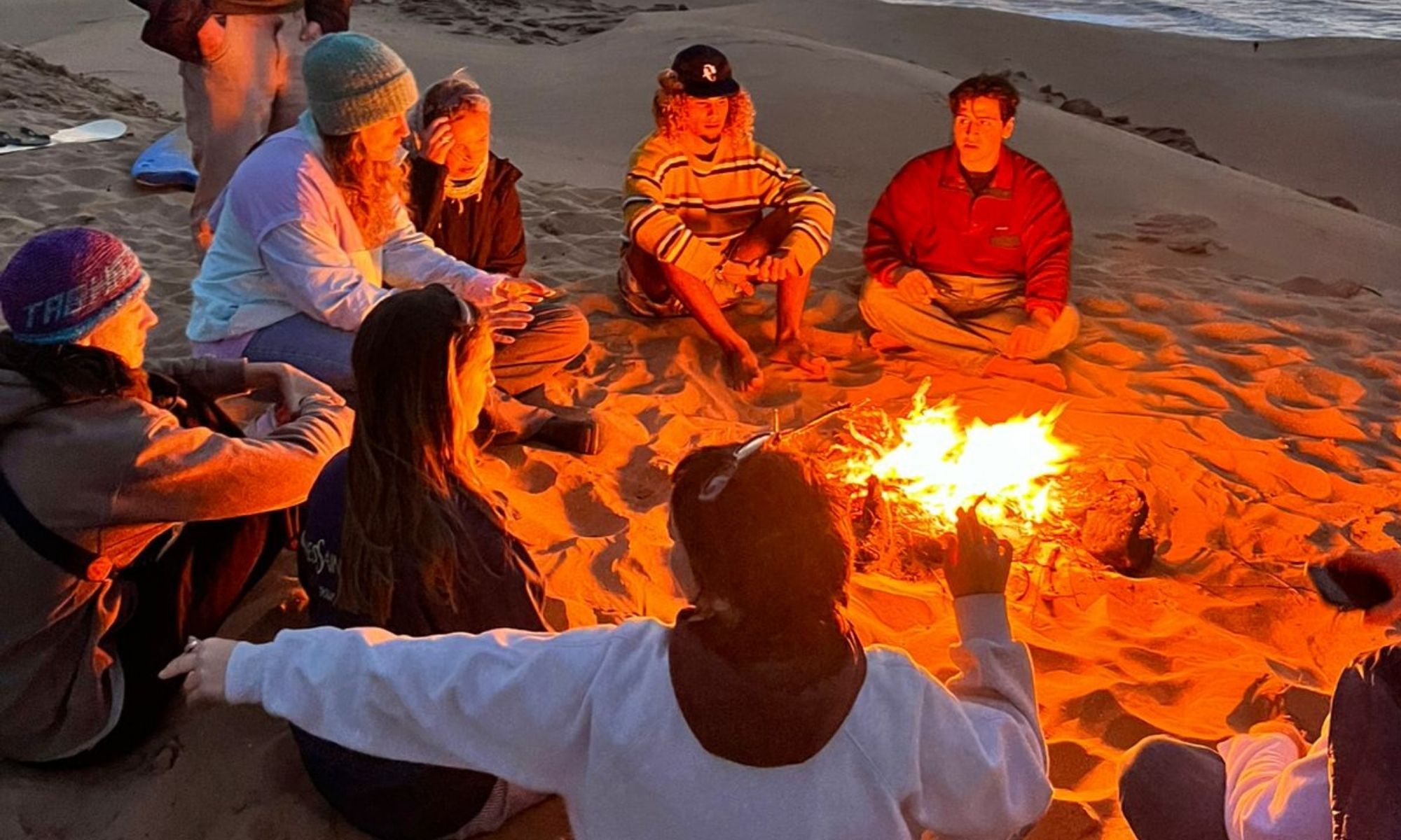 Moroccan tea and bonfire after sandboarding at the Timlalin Dunes