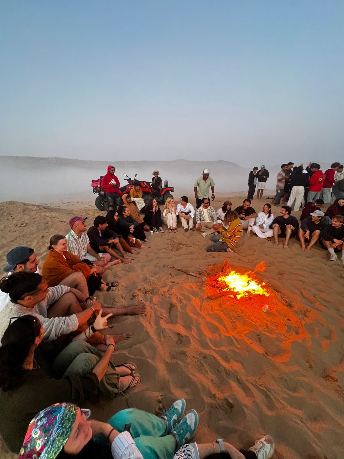 Bonfire and tea after sandboarding in the Timlaline dunes near Taghazout